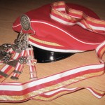 Band, Mütze und Bierzipf